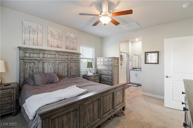42 Late Harvest Ave, Pahrump, NV 89060 - bedroom with light colored carpet, connected bathroom, baseboards, and a ceiling fan