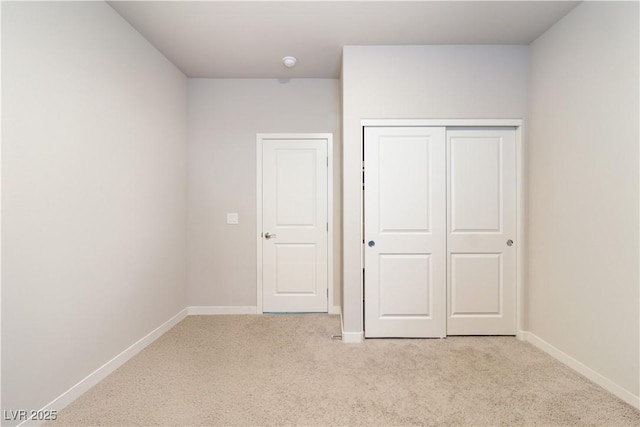 42 Late Harvest Ave, Pahrump, NV 89060 - unfurnished bedroom featuring light carpet, baseboards, and a closet