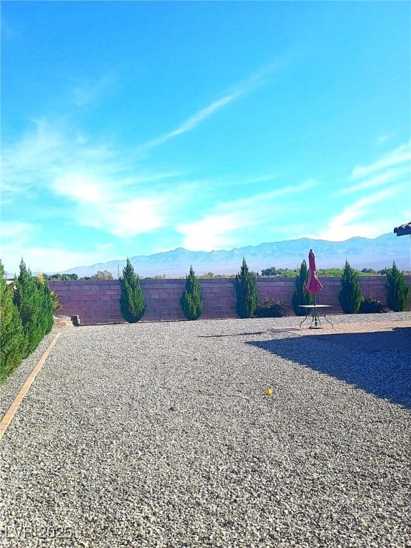 42 Late Harvest Ave, Pahrump, NV 89060 - fenced backyard featuring a mountain view