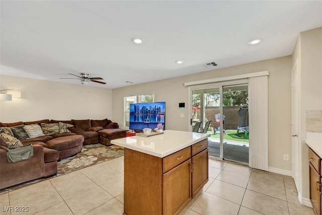 5321 Welch Valley Ave, Las Vegas, NV 89131 - kitchen with light countertops, light tile patterned floors, a ceiling fan, open floor plan, and recessed lighting