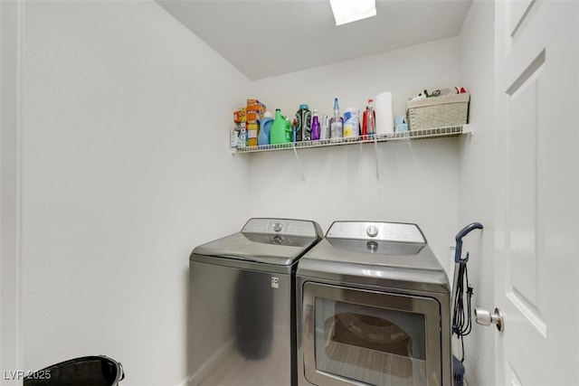 5321 Welch Valley Ave, Las Vegas, NV 89131 - washroom with washing machine and clothes dryer and baseboards