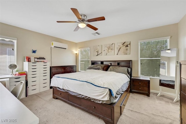 5321 Welch Valley Ave, Las Vegas, NV 89131 - bedroom with a wall mounted air conditioner, light colored carpet, and ceiling fan