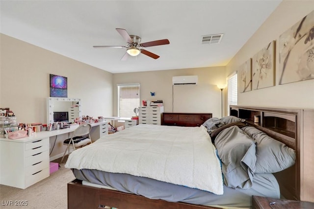 5321 Welch Valley Ave, Las Vegas, NV 89131 - bedroom featuring a wall mounted air conditioner, multiple windows, light colored carpet, and a ceiling fan