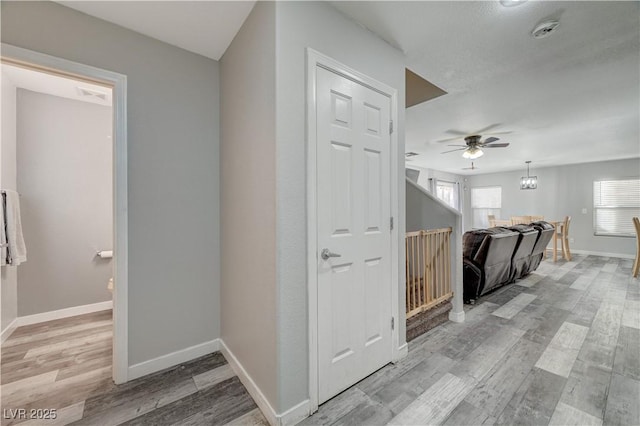 687 Porchtown Ave, Las Vegas, NV 89183 - corridor featuring baseboards and light wood-type flooring