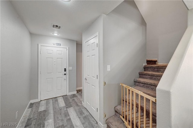 687 Porchtown Ave, Las Vegas, NV 89183 - foyer with light wood-style flooring, stairs, and baseboards