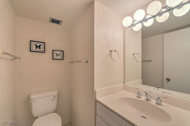 3111 Bel Air Dr Unit 23A, Las Vegas, NV 89109 - half bathroom featuring toilet and vanity