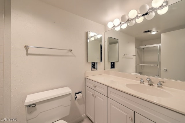 3111 Bel Air Dr Unit 23A, Las Vegas, NV 89109 - full bathroom featuring toilet, a shower stall, and vanity