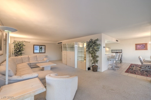 3111 Bel Air Dr Unit 23A, Las Vegas, NV 89109 - living room featuring light carpet