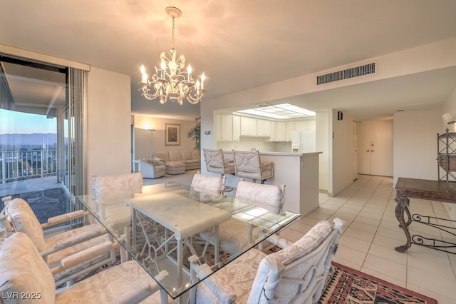 3111 Bel Air Dr Unit 23A, Las Vegas, NV 89109 - dining space featuring a chandelier and light tile patterned flooring