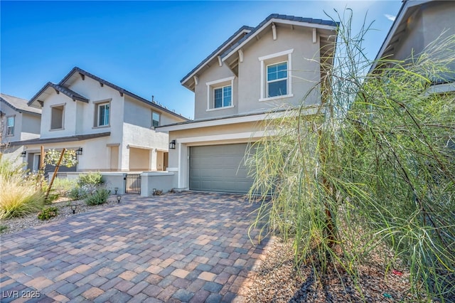 688 Monroe Hill Pl, Henderson, NV 89011 - traditional-style house with stucco siding, an attached garage, a gate, and driveway