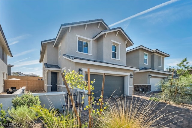 688 Monroe Hill Pl, Henderson, NV 89011 - traditional home with stucco siding, an attached garage, stone siding, and driveway
