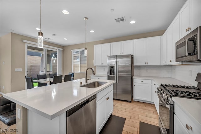 688 Monroe Hill Pl, Henderson, NV 89011 - kitchen with stainless steel appliances, a sink, light countertops, tasteful backsplash, and recessed lighting