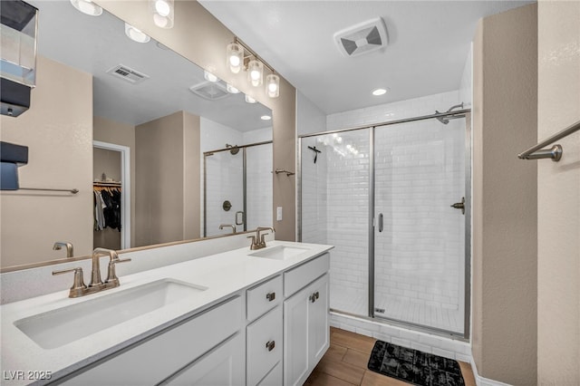 688 Monroe Hill Pl, Henderson, NV 89011 - full bath featuring double vanity, a shower stall, a walk in closet, and recessed lighting