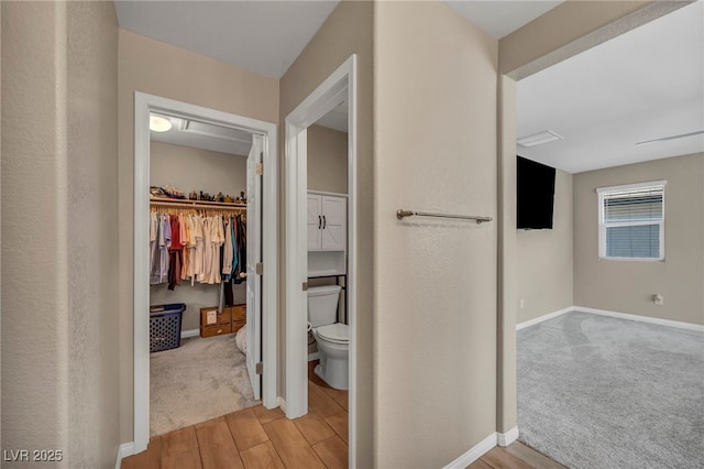 688 Monroe Hill Pl, Henderson, NV 89011 - corridor with light wood finished floors, baseboards, and light carpet