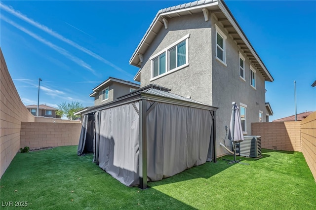 688 Monroe Hill Pl, Henderson, NV 89011 - back of property with central AC unit, a gazebo, and stucco siding