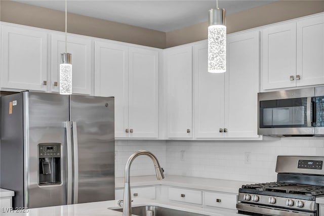 688 Monroe Hill Pl, Henderson, NV 89011 - kitchen featuring appliances with stainless steel finishes, light countertops, decorative backsplash, and white cabinets