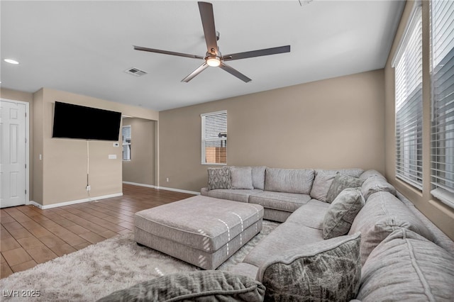 688 Monroe Hill Pl, Henderson, NV 89011 - living room featuring plenty of natural light, ceiling fan, wood finished floors, baseboards, and recessed lighting
