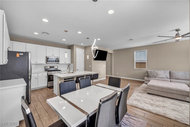 688 Monroe Hill Pl, Henderson, NV 89011 - dining area with ceiling fan, wood finish floors, recessed lighting, and baseboards