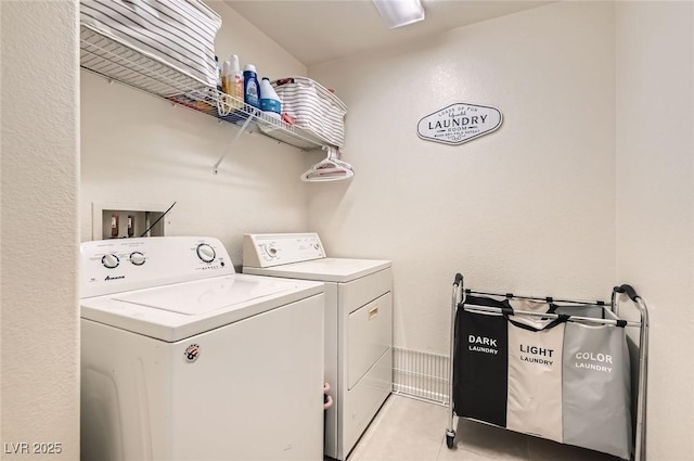 8252 Pearl Oasis Ct, Las Vegas, NV 89139 - washroom with separate washer and dryer and light tile patterned floors