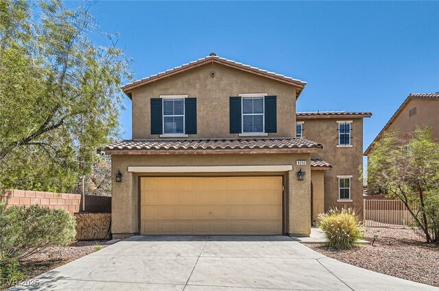 8252 Pearl Oasis Ct, Las Vegas, NV 89139 - mediterranean / spanish-style house with a garage, stucco siding, concrete driveway, and a tile roof