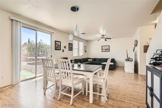 8252 Pearl Oasis Ct, Las Vegas, NV 89139 - dining area featuring light wood-style floors, healthy amount of natural light, and a ceiling fan