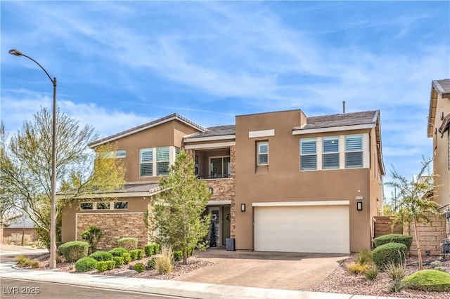 9655 Skye Star Ave, Las Vegas, NV 89166 - view of front of house featuring stucco siding, a garage, decorative driveway, and stone siding