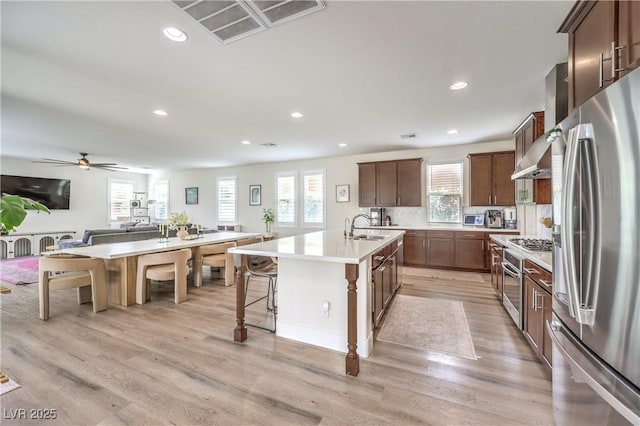 9655 Skye Star Ave, Las Vegas, NV 89166 - kitchen featuring stainless steel appliances, a sink, an island with sink, recessed lighting, and plenty of natural light
