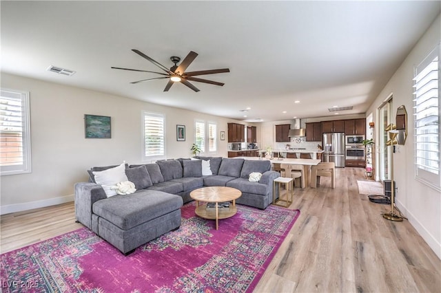 9655 Skye Star Ave, Las Vegas, NV 89166 - living room featuring light wood-type flooring, a ceiling fan, recessed lighting, and baseboards