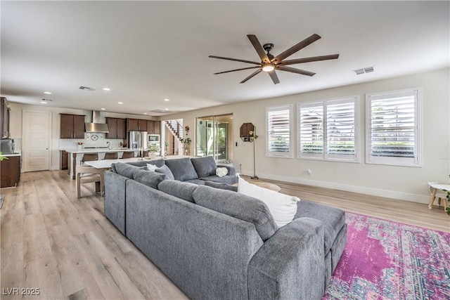 9655 Skye Star Ave, Las Vegas, NV 89166 - living room featuring a ceiling fan, light wood-style floors, baseboards, and recessed lighting