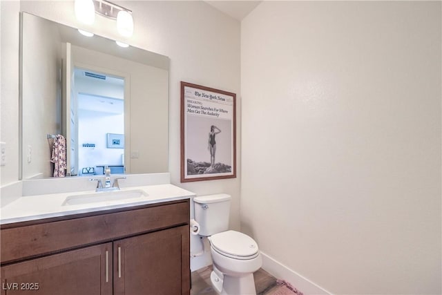 9655 Skye Star Ave, Las Vegas, NV 89166 - bathroom featuring vanity, toilet, and baseboards