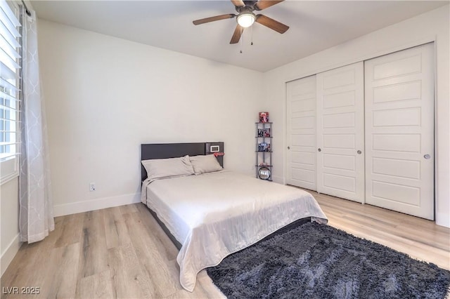 9655 Skye Star Ave, Las Vegas, NV 89166 - bedroom with light wood-type flooring, baseboards, a closet, and ceiling fan