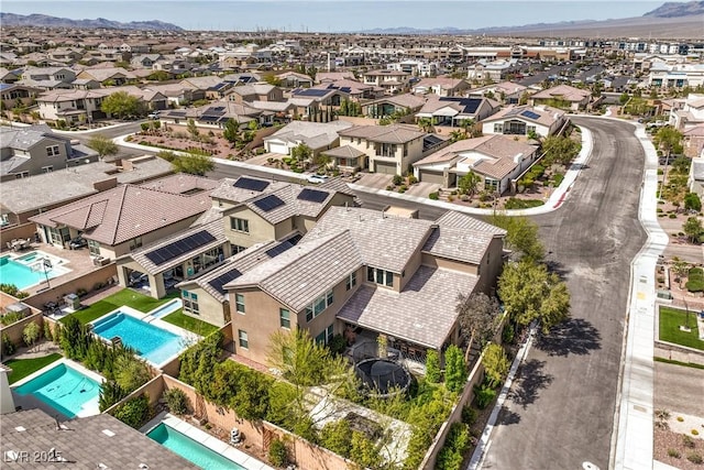 9655 Skye Star Ave, Las Vegas, NV 89166 - aerial perspective of suburban area featuring a pool and a mountainous background