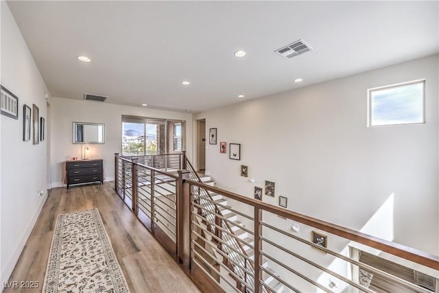 9655 Skye Star Ave, Las Vegas, NV 89166 - corridor featuring an upstairs landing, wood finished floors, recessed lighting, and baseboards