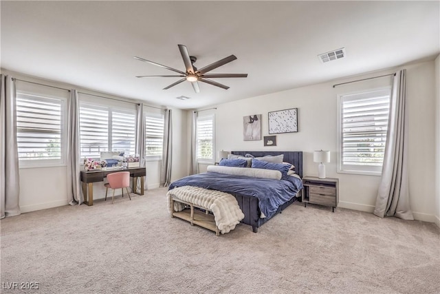 9655 Skye Star Ave, Las Vegas, NV 89166 - carpeted bedroom with multiple windows, baseboards, a ceiling fan, and an office area