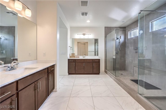 9655 Skye Star Ave, Las Vegas, NV 89166 - full bath featuring two vanities, a stall shower, marble finish floors, and baseboards