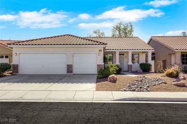 8849 Pheasant Valley Way, Las Vegas, NV 89123 - view of front of house featuring an attached garage, stone siding, concrete driveway, and stucco siding