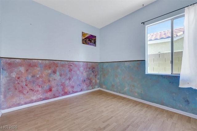 8849 Pheasant Valley Way, Las Vegas, NV 89123 - empty room with wood finished floors, baseboards, and wallpapered walls