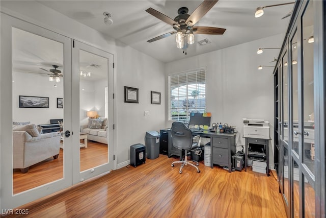 10213 Treasure Mountain Ct, Las Vegas, NV 89129 - office area with ceiling fan, french doors, and light wood-style floors