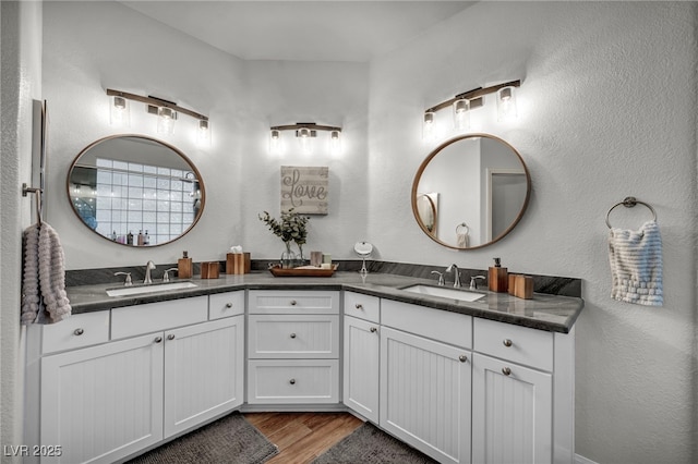 10213 Treasure Mountain Ct, Las Vegas, NV 89129 - full bathroom with double vanity and wood finished floors