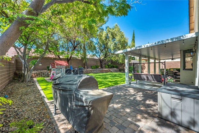 10213 Treasure Mountain Ct, Las Vegas, NV 89129 - view of patio / terrace featuring a grill, ceiling fan, and a hot tub