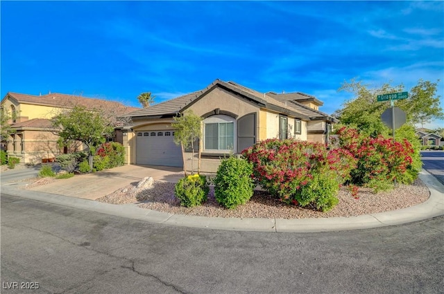 11441 Drappo Ave, Las Vegas, NV 89138 - ranch-style home featuring stucco siding, a garage, and driveway