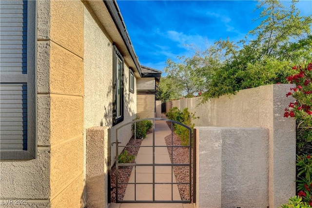 11441 Drappo Ave, Las Vegas, NV 89138 - view of property exterior featuring stucco siding and a gate