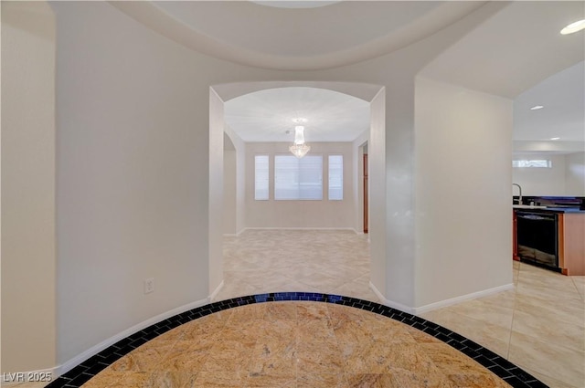 11441 Drappo Ave, Las Vegas, NV 89138 - hallway with inlaid floor details, recessed lighting, baseboards, and arched walkways