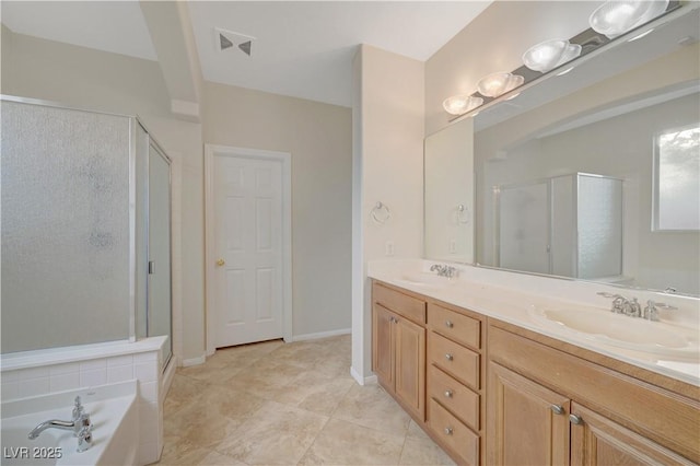 11441 Drappo Ave, Las Vegas, NV 89138 - bathroom featuring a shower stall, double vanity, a garden tub, and tile patterned floors