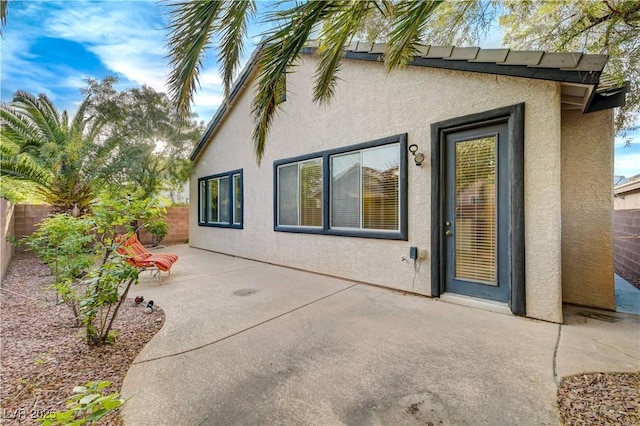 11441 Drappo Ave, Las Vegas, NV 89138 - back of house featuring stucco siding, a patio area, and a fenced backyard