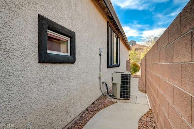 11441 Drappo Ave, Las Vegas, NV 89138 - view of side of property featuring stucco siding and central AC