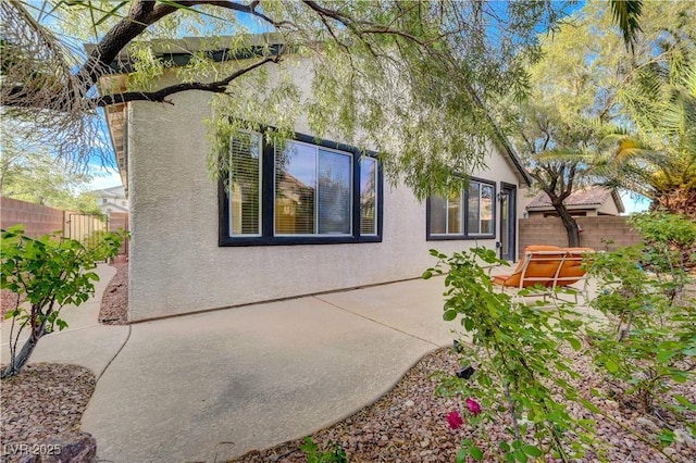11441 Drappo Ave, Las Vegas, NV 89138 - back of house with a jacuzzi, stucco siding, and a fenced backyard