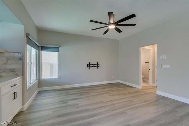 10908 Royal Highlands St, Las Vegas, NV 89141 - empty room with ceiling fan, light wood-style floors, and baseboards