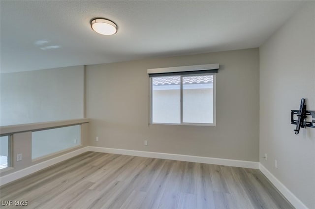 10908 Royal Highlands St, Las Vegas, NV 89141 - unfurnished room with wood finished floors and baseboards