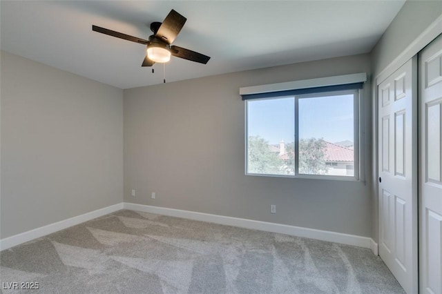 10908 Royal Highlands St, Las Vegas, NV 89141 - unfurnished room with a ceiling fan, light colored carpet, and baseboards